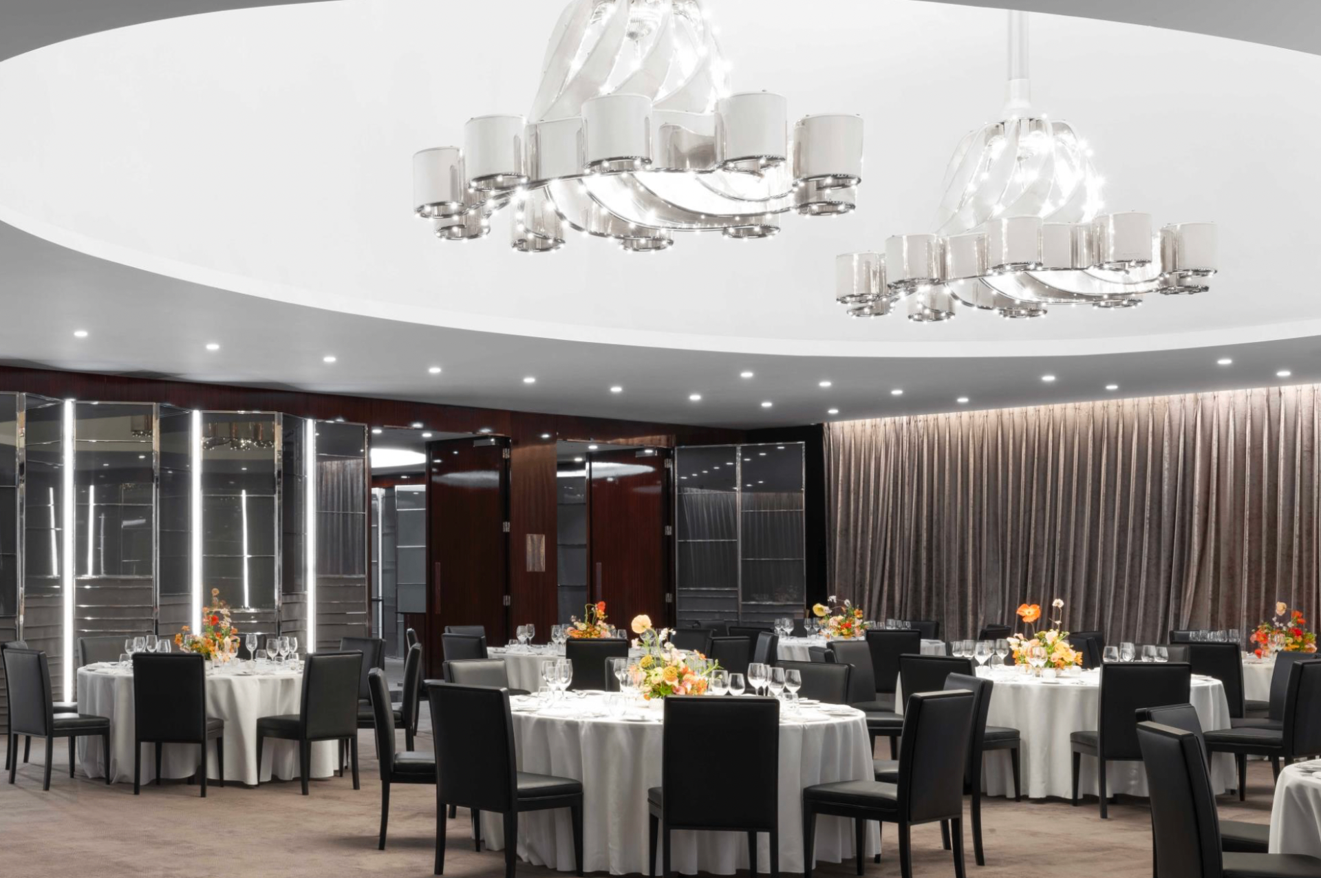 Ballroom with chandeliers and round tables
